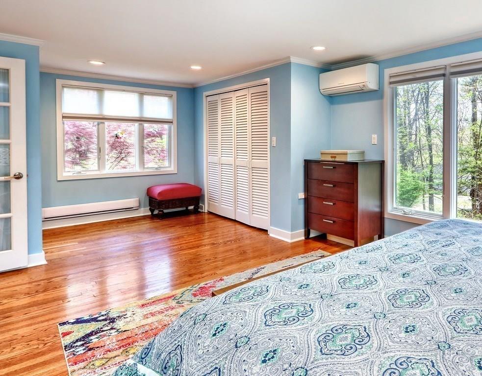 11 Juniper Ridge Road Lincoln, MA 01773 - Photo 17 of 36 a bedroom with a bed and wooden floor