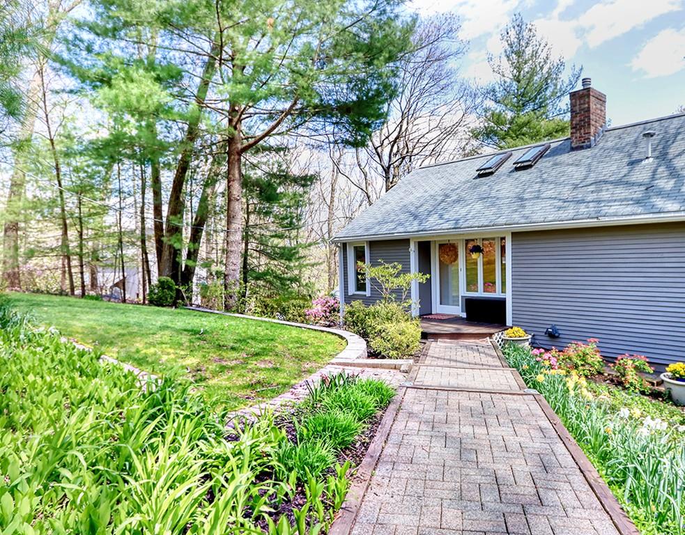 11 Juniper Ridge Road Lincoln, MA 01773 - Photo 2 of 36 a front view of a house with a yard