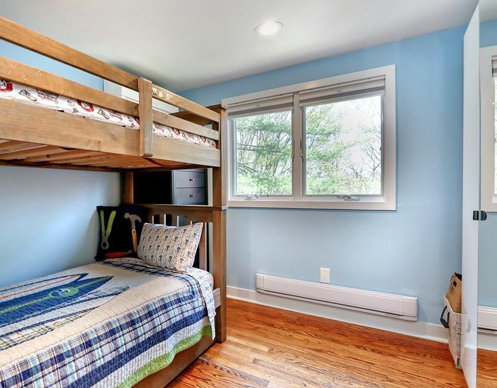 11 Juniper Ridge Road Lincoln, MA 01773 - Photo 23 of 36 a bedroom with a bed and a window