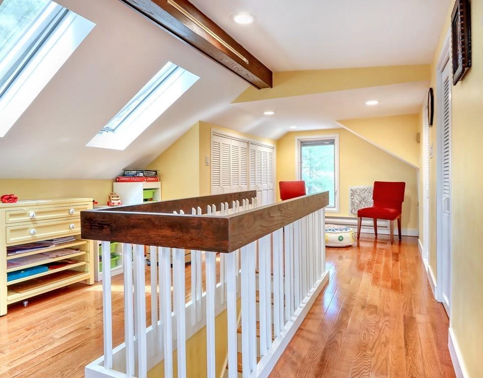 11 Juniper Ridge Road Lincoln, MA 01773 - Photo 26 of 36 a hallway with furniture and wooden floor
