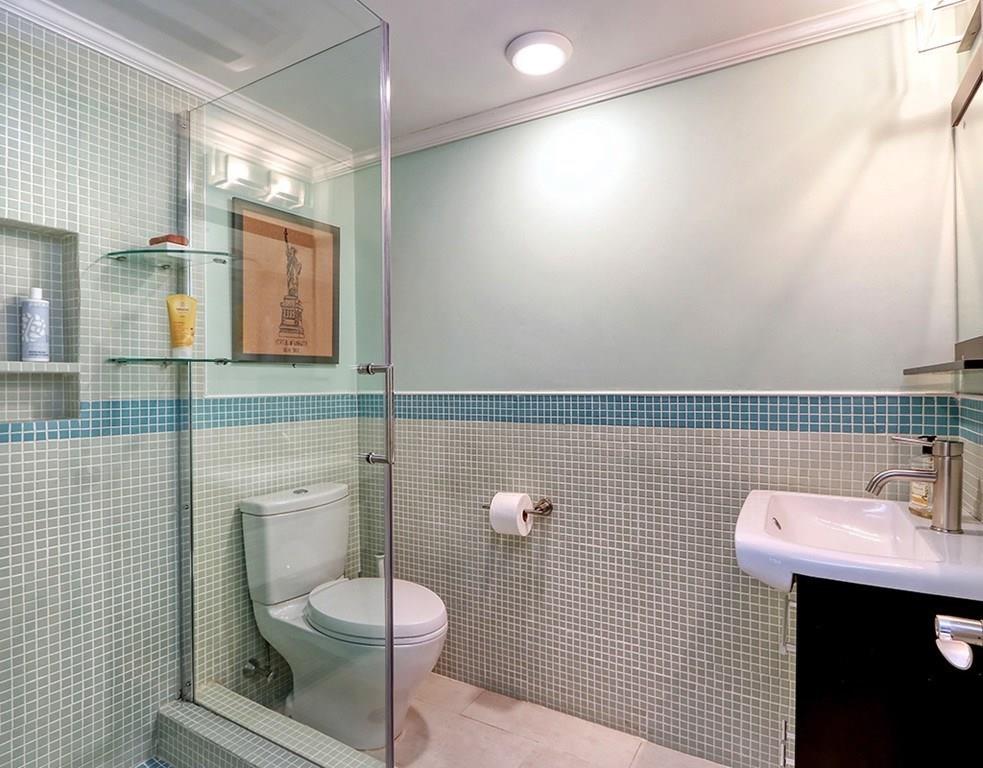 11 Juniper Ridge Road Lincoln, MA 01773 - Photo 27 of 36 a bathroom with a toilet sink and mirror