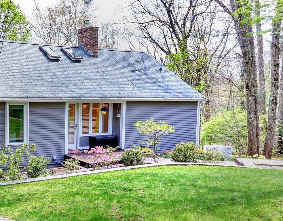 11 Juniper Ridge Road Lincoln, MA 01773 - Photo 28 of 36 a view of a house with a yard and plants