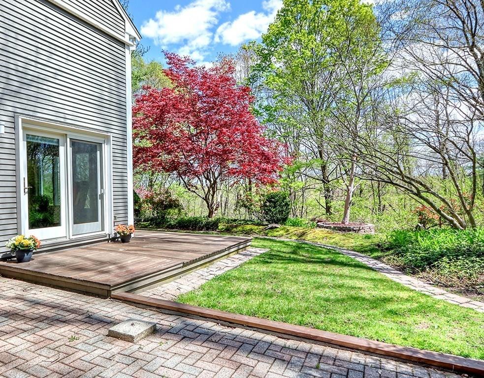 11 Juniper Ridge Road Lincoln, MA 01773 - Photo 29 of 36 a view of a house with a small yard and a large tree