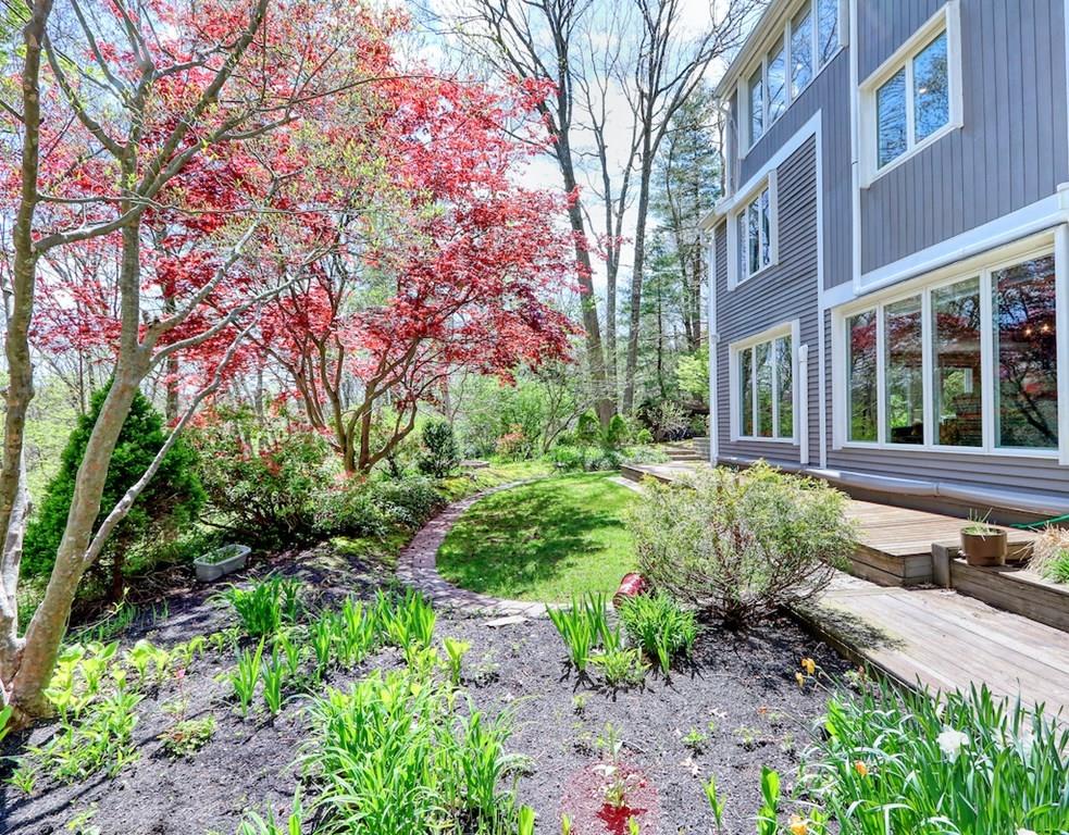 11 Juniper Ridge Road Lincoln, MA 01773 - Photo 32 of 36 a view of a house with lots of plants and large trees