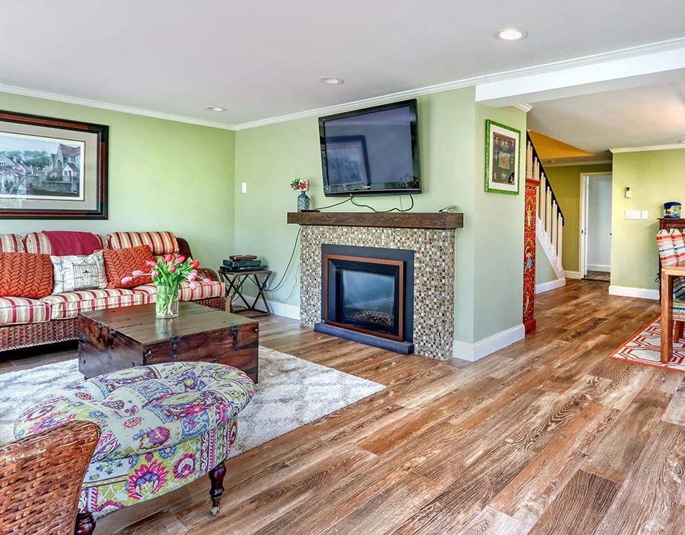 11 Juniper Ridge Road Lincoln, MA 01773 - Photo 6 of 36 a living room with furniture and a fireplace