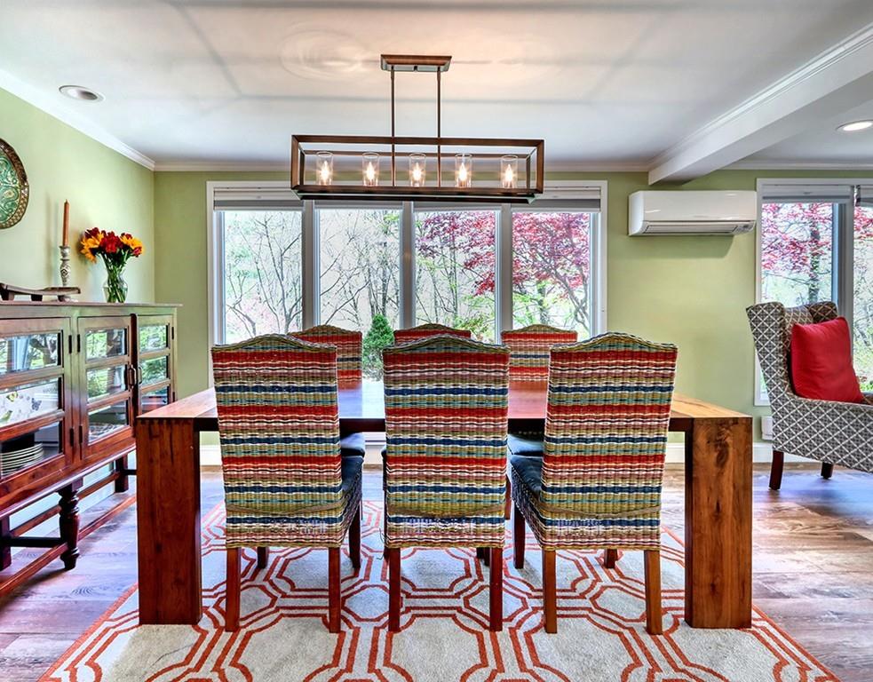 11 Juniper Ridge Road Lincoln, MA 01773 - Photo 7 of 36 a view of a dining room with furniture window and outside view