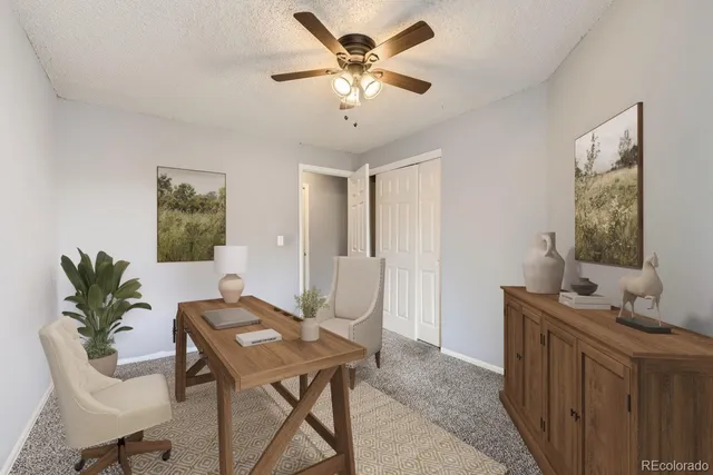 a workspace with furniture and window