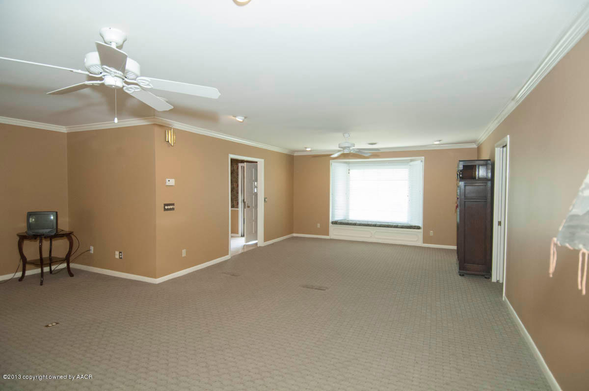 6206 Calumet Road Amarillo, TX 79106 - Photo 4 of 47 a view of an empty room with a window