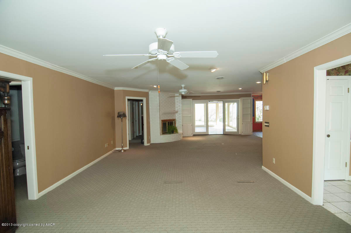 6206 Calumet Road Amarillo, TX 79106 - Photo 5 of 47 a view of an empty room with a window