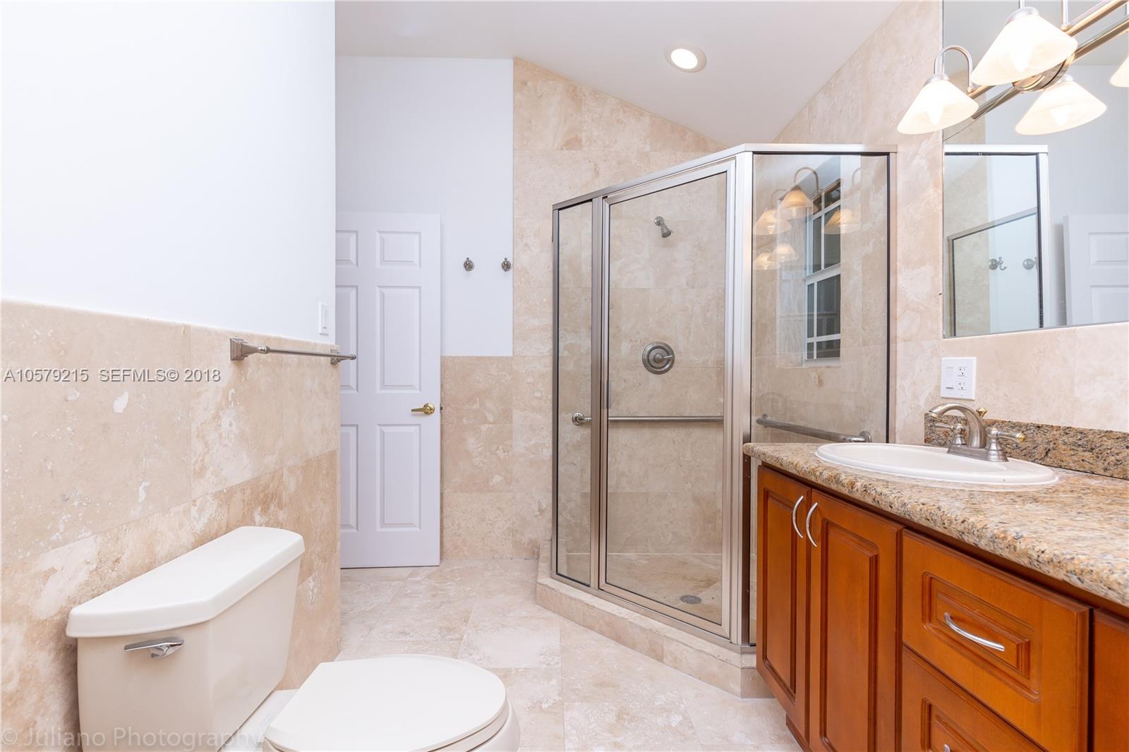 211 Southwest 29th Road Miami, FL 33129 - Photo 14 of 33 a bathroom with a granite countertop sink toilet and shower