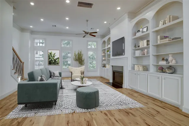a living room with fireplace furniture and a flat screen tv