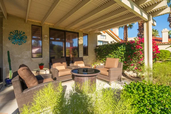 a outdoor living space with furniture and garden view