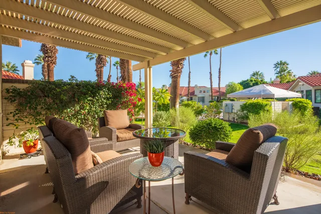 a outdoor living space with furniture and garden view