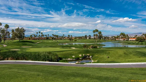 a view of a golf course with a garden