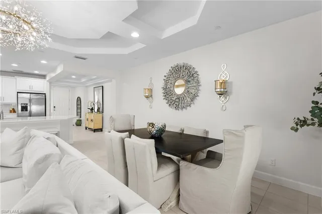 a living room with furniture and painting on the wall