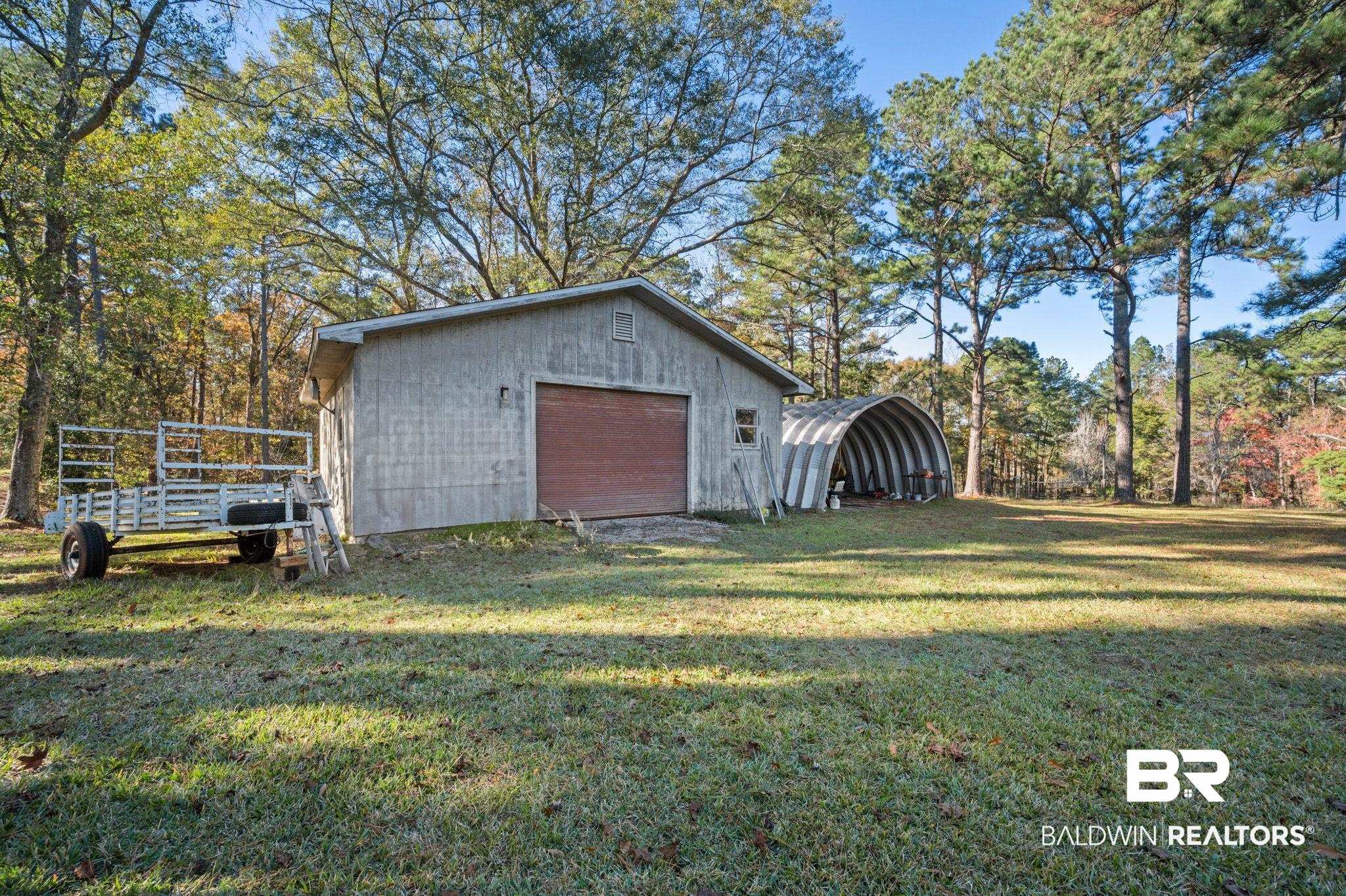 15801 Maytower Road Bay Minette, AL 36507 - Photo 36 of 43 View of outdoor structure with a garage and a yard