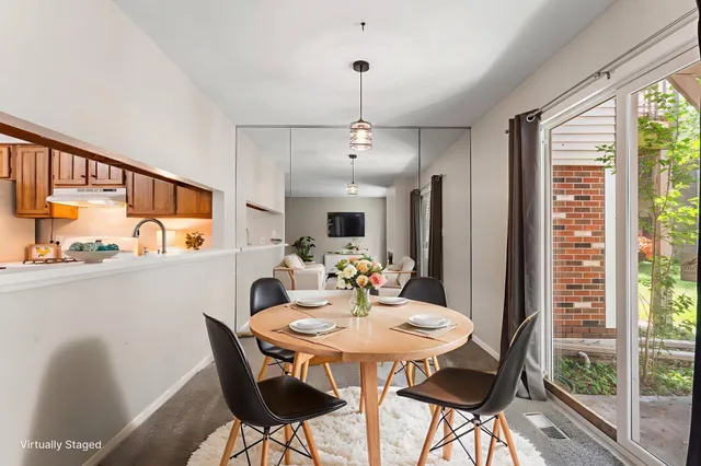 a view of a dining room with furniture window and outside view