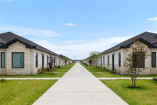 a front view of a house with swimming pool