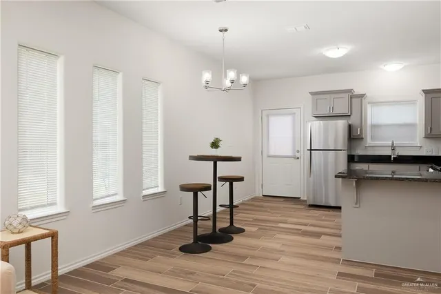 a kitchen with a refrigerator stove and microwave