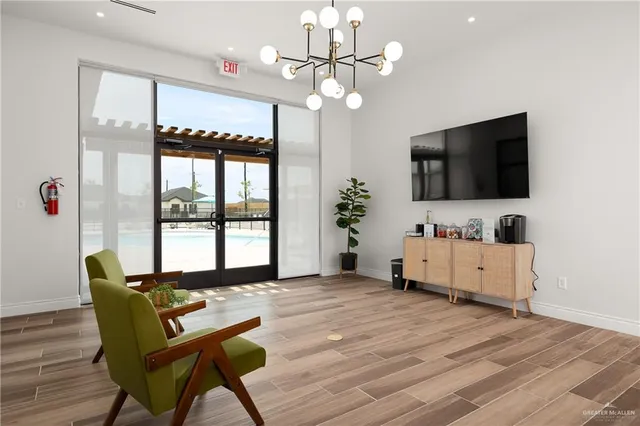 a view of a dining room with furniture and a window