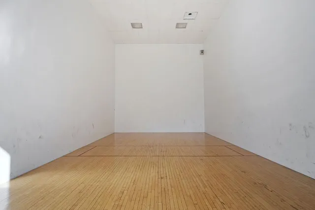 a view of hallway with white floor