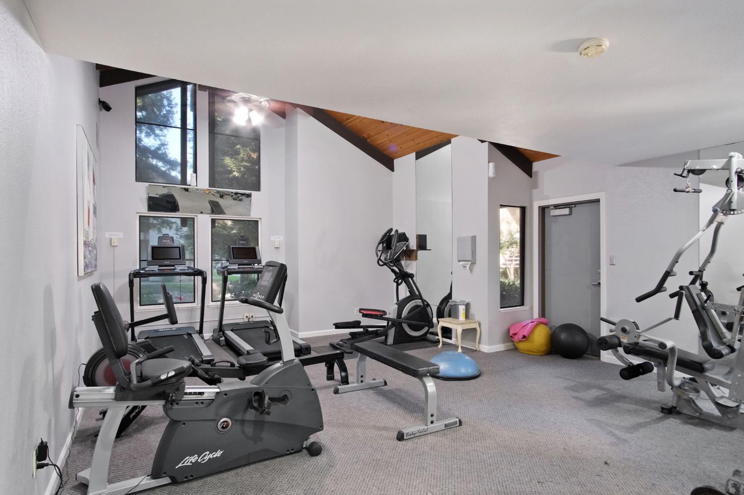3701 Colonial Drive, Unit 156 Modesto, CA 95356 - Photo 22 of 32 a view of a room with gym equipment