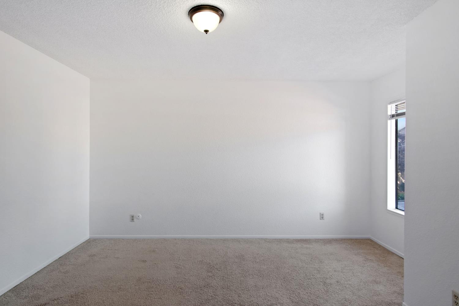 3701 Colonial Drive, Unit 156 Modesto, CA 95356 - Photo 24 of 32 an empty room with windows