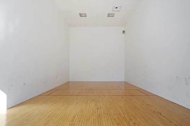 a view of a backyard with swimming pool