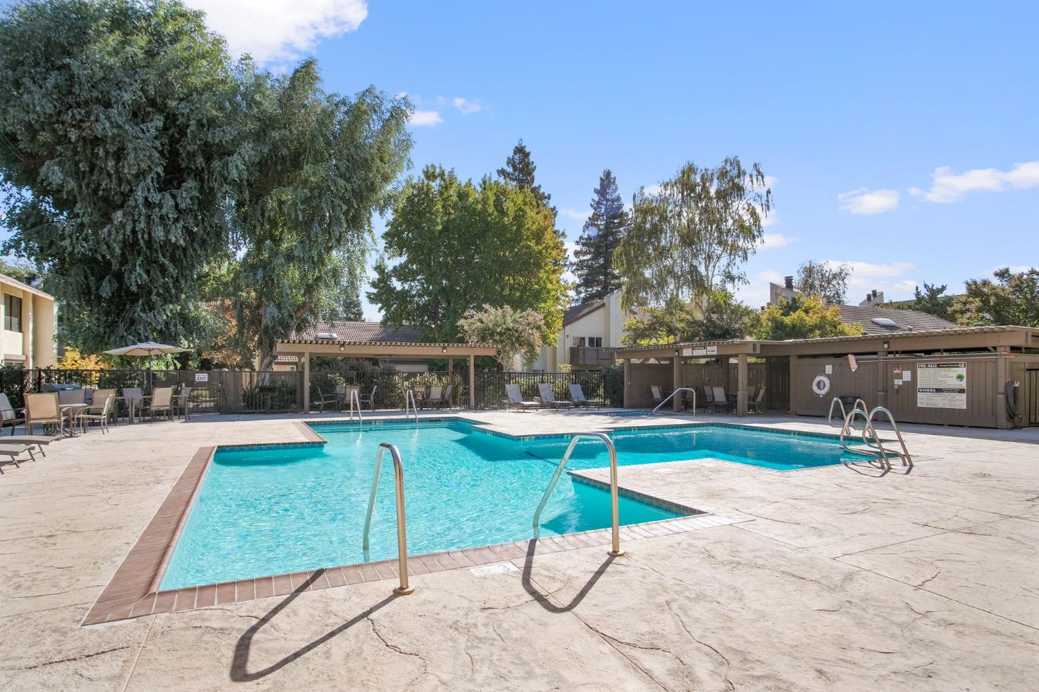 3701 Colonial Drive, Unit 156 Modesto, CA 95356 - Photo 29 of 32 a view of a backyard with swimming pool