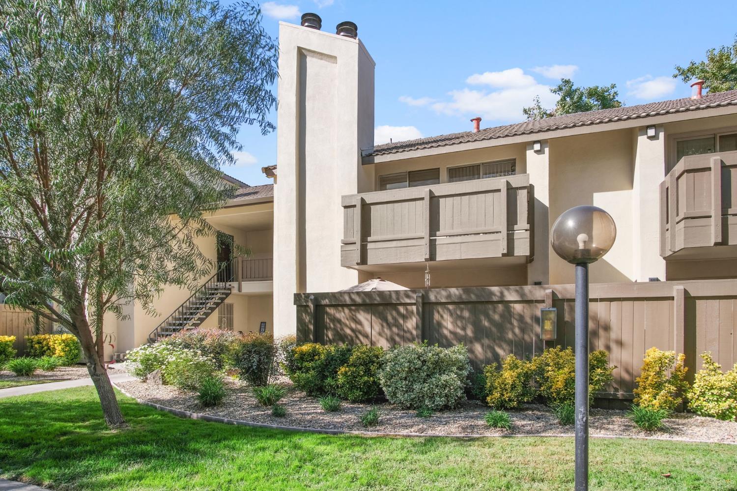 3701 Colonial Drive, Unit 156 Modesto, CA 95356 - Photo 3 of 32 a front view of a house with garden