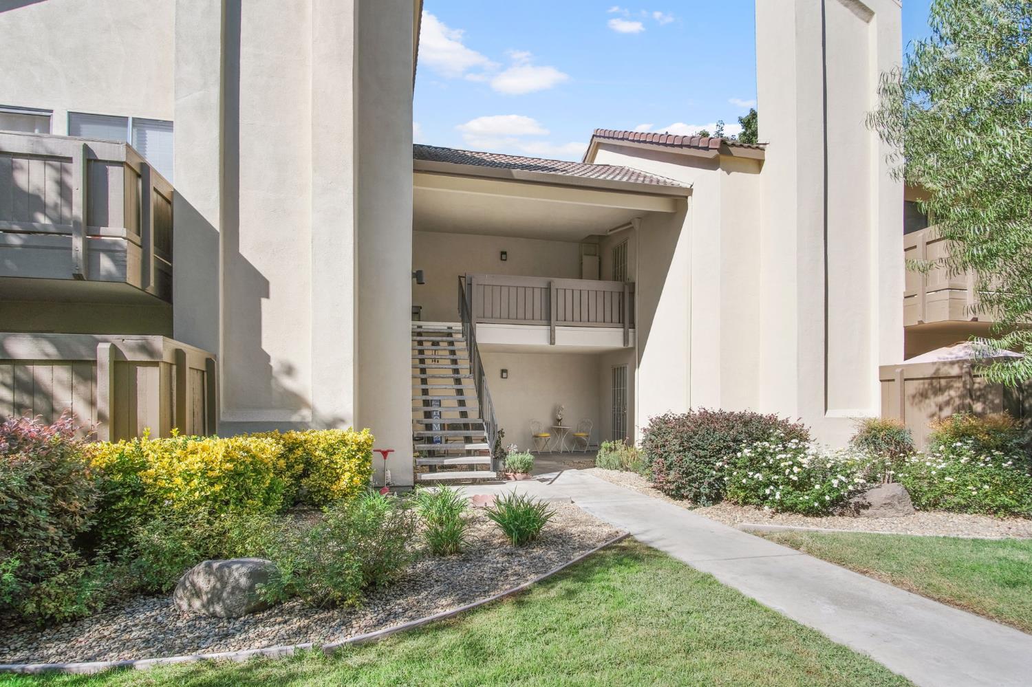 3701 Colonial Drive, Unit 156 Modesto, CA 95356 - Photo 5 of 32 front view of a house with a yard