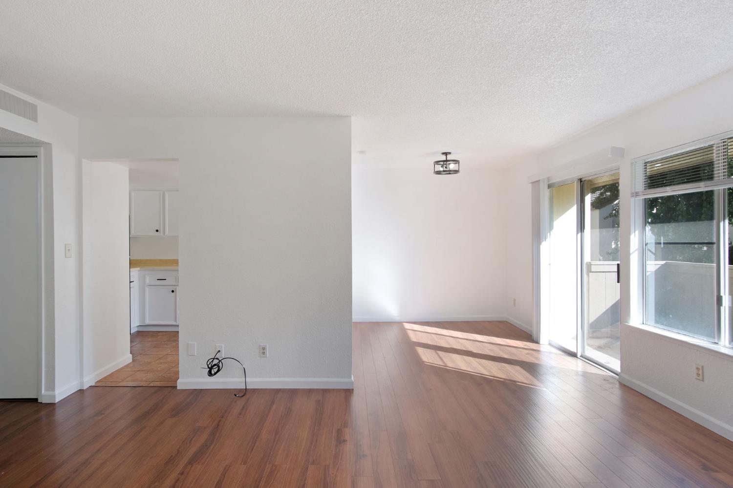 3701 Colonial Drive, Unit 156 Modesto, CA 95356 - Photo 6 of 32 wooden floor in an empty room
