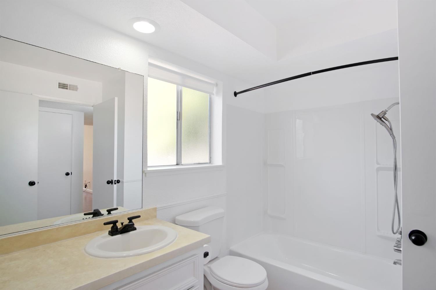 3701 Colonial Drive, Unit 156 Modesto, CA 95356 - Photo 10 of 32 a bathroom with a sink toilet and shower