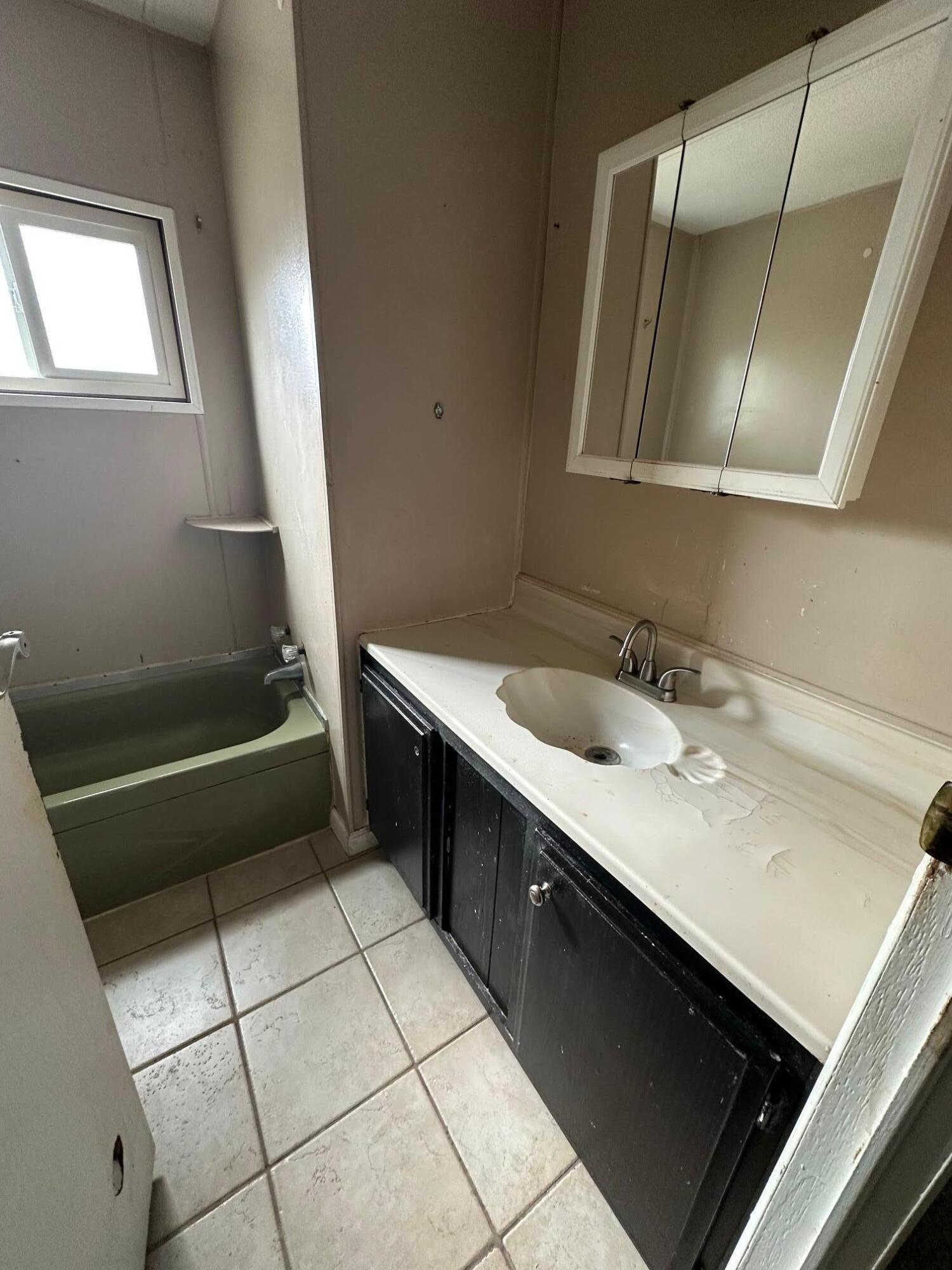 421 Stevens Road, Unit 52 Eagle Point, OR 97524 - Photo 10 of 18 a bathroom with a double vanity sink a toilet and a mirror