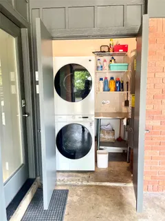 a house view with a sitting space and garden