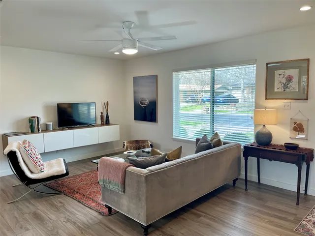 a bedroom with furniture and a lamp