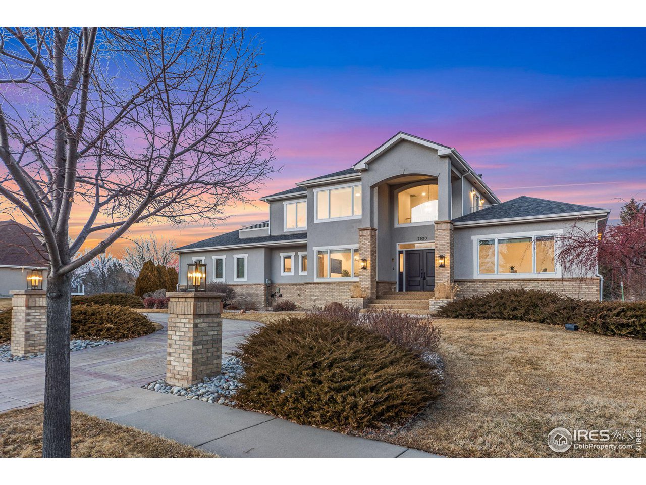 7930 Eagle Ranch Road Fort Collins, CO 80528 - Photo 1 of 40 a front view of a house with a yard
