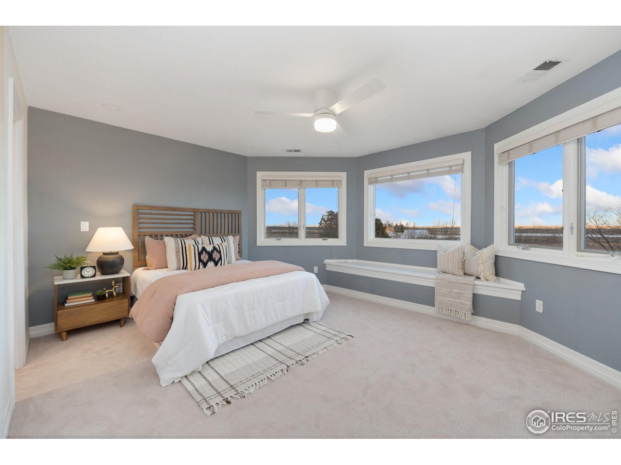 7930 Eagle Ranch Road Fort Collins, CO 80528 - Photo 19 of 40 a bedroom with a large bed and furniture