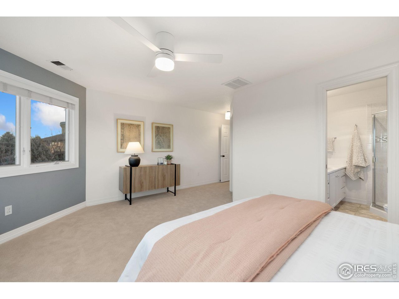 7930 Eagle Ranch Road Fort Collins, CO 80528 - Photo 20 of 40 a bedroom with a bed and a large window