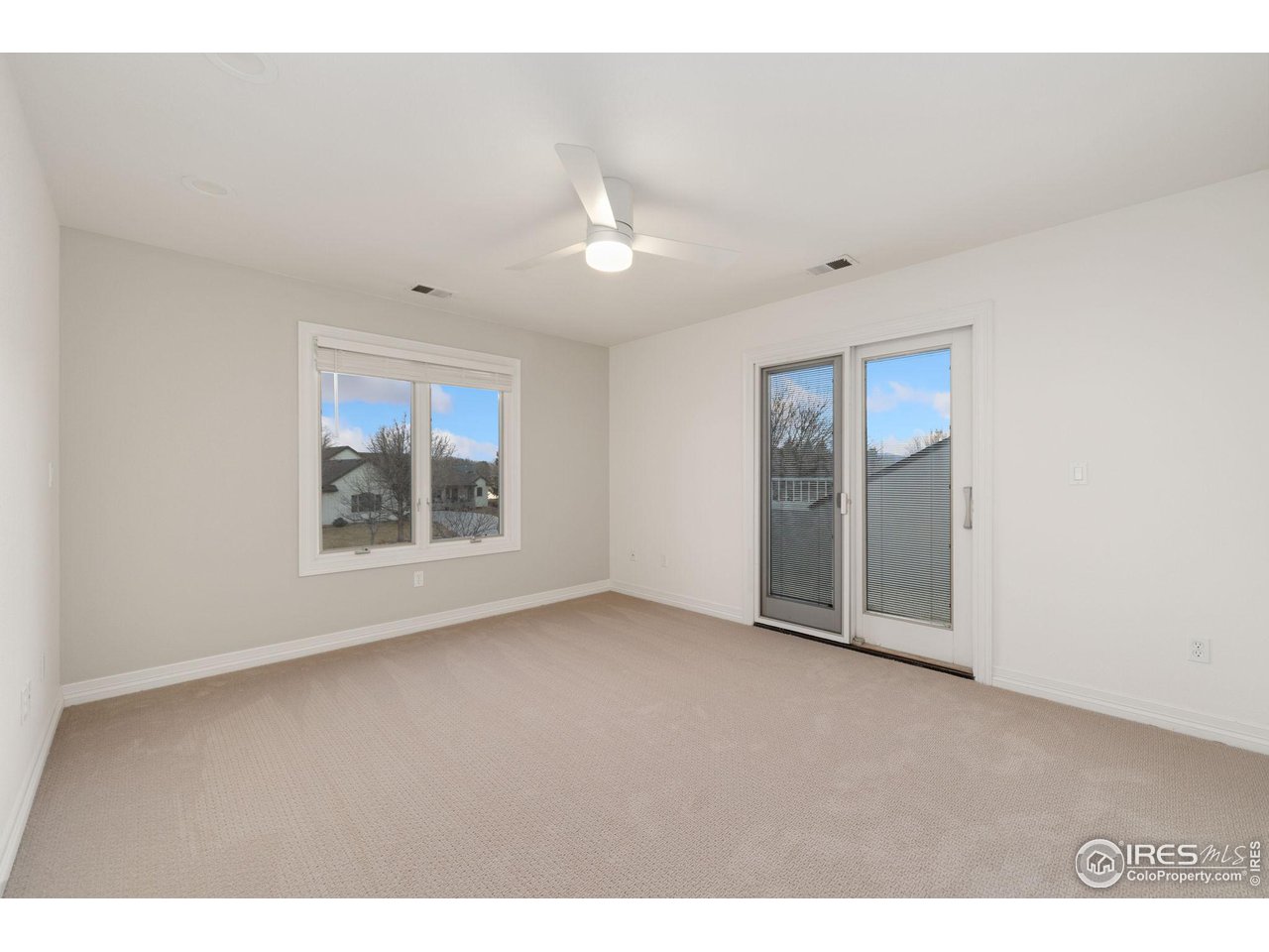 7930 Eagle Ranch Road Fort Collins, CO 80528 - Photo 22 of 40 a view of an empty room with a window