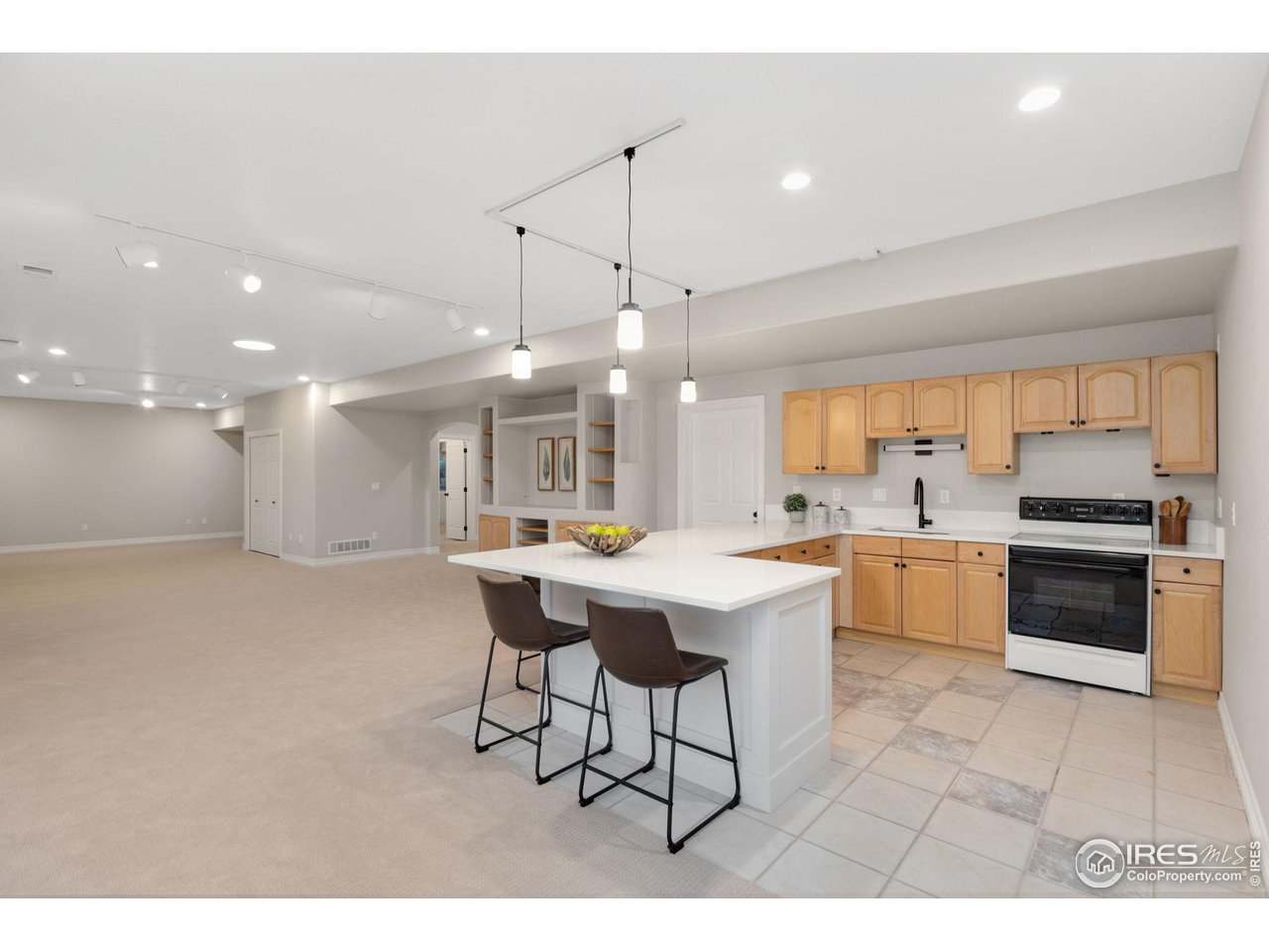7930 Eagle Ranch Road Fort Collins, CO 80528 - Photo 29 of 40 a large kitchen with a table and chairs in it