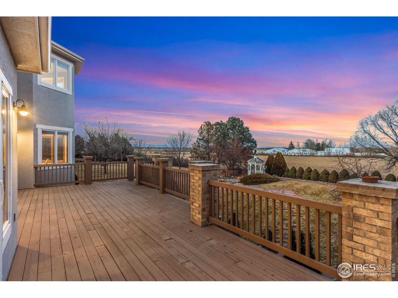 7930 Eagle Ranch Road Fort Collins, CO 80528 - Photo 32 of 40 a view of a balcony with wooden floor