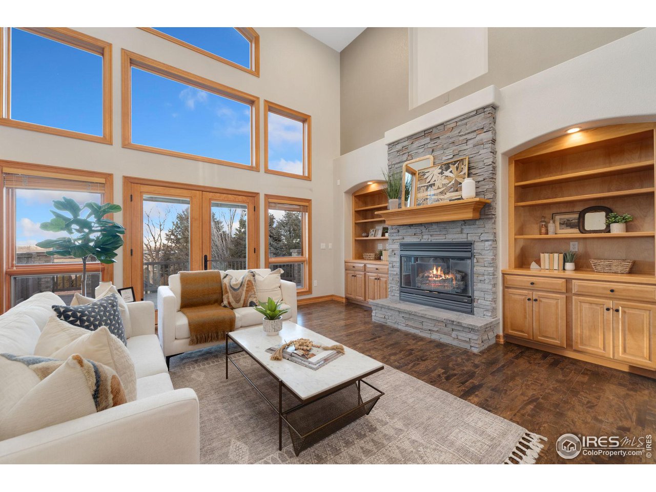 7930 Eagle Ranch Road Fort Collins, CO 80528 - Photo 4 of 40 a living room with furniture and a fireplace