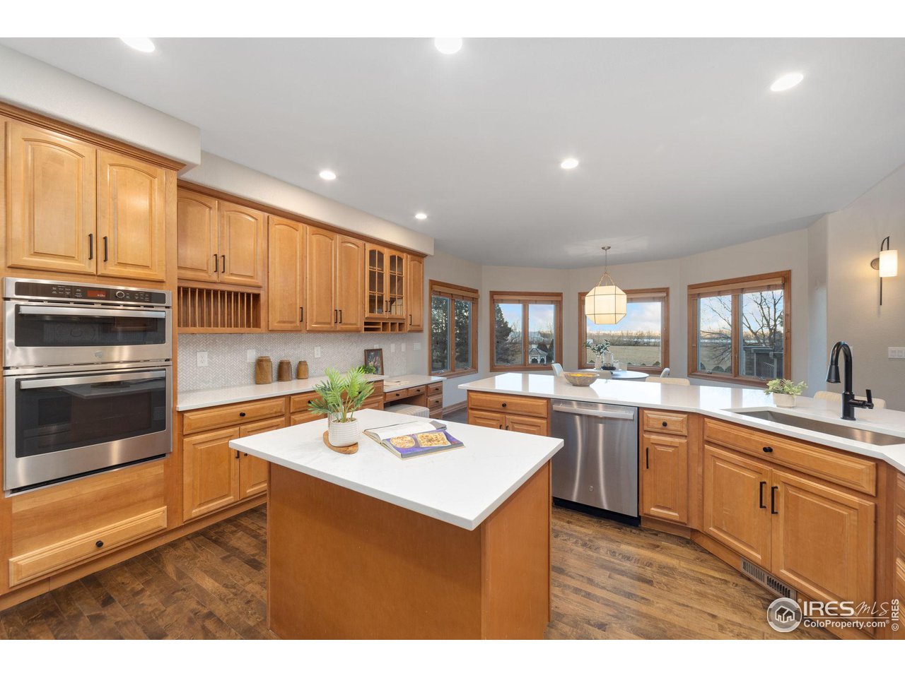 7930 Eagle Ranch Road Fort Collins, CO 80528 - Photo 10 of 40 a kitchen with a sink stove and cabinets