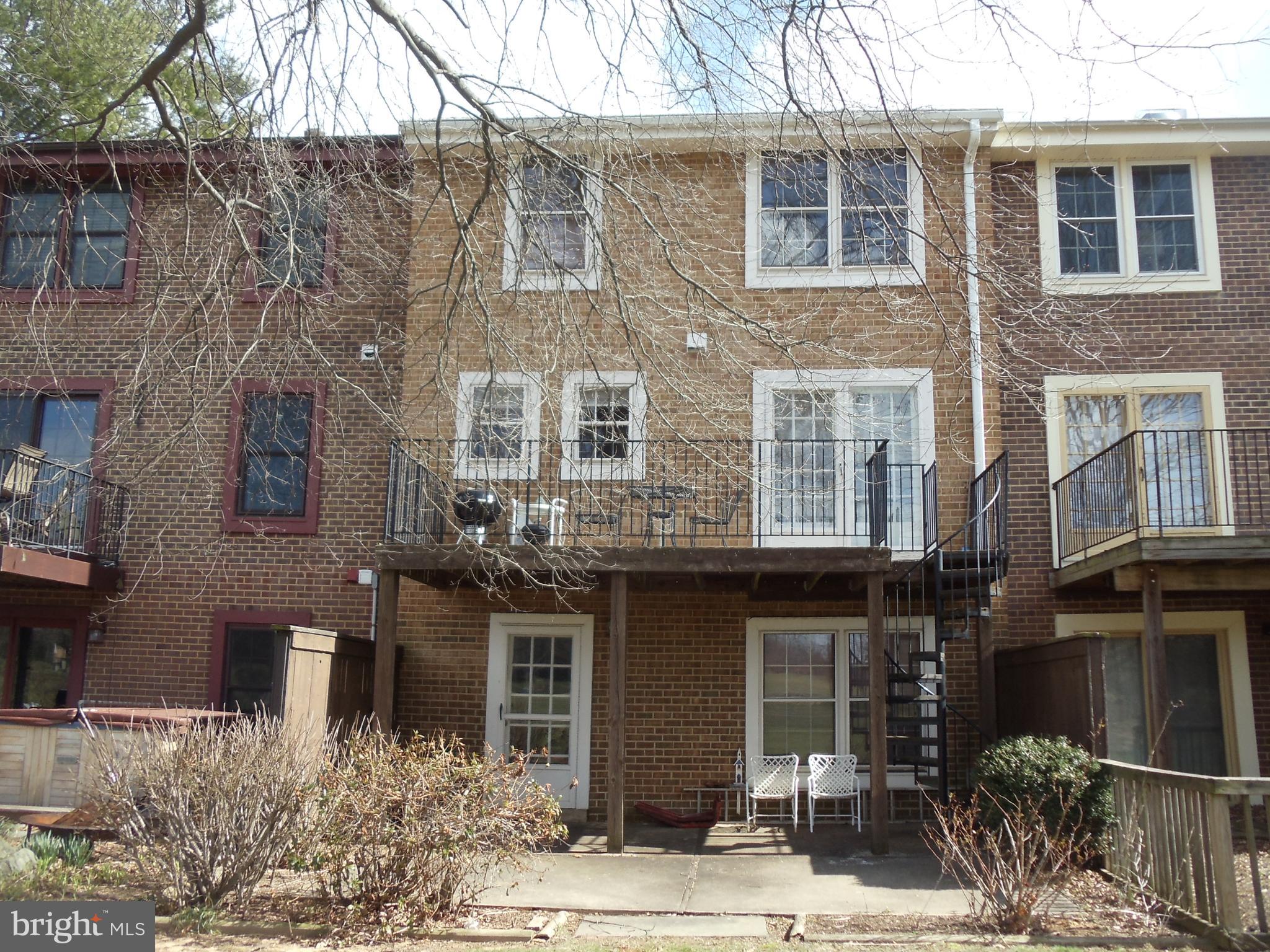 2186 Golf Course Drive Reston, VA 20191 - Photo 2 of 30 a front view of a building with balcony