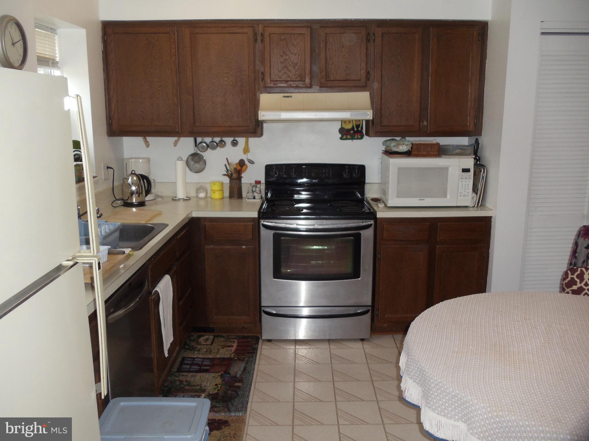2186 Golf Course Drive Reston, VA 20191 - Photo 11 of 30 a kitchen with a stove and a refrigerator