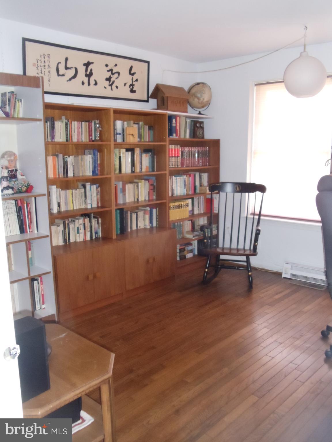 2186 Golf Course Drive Reston, VA 20191 - Photo 12 of 30 a view of a workspace with furniture and a book shelf