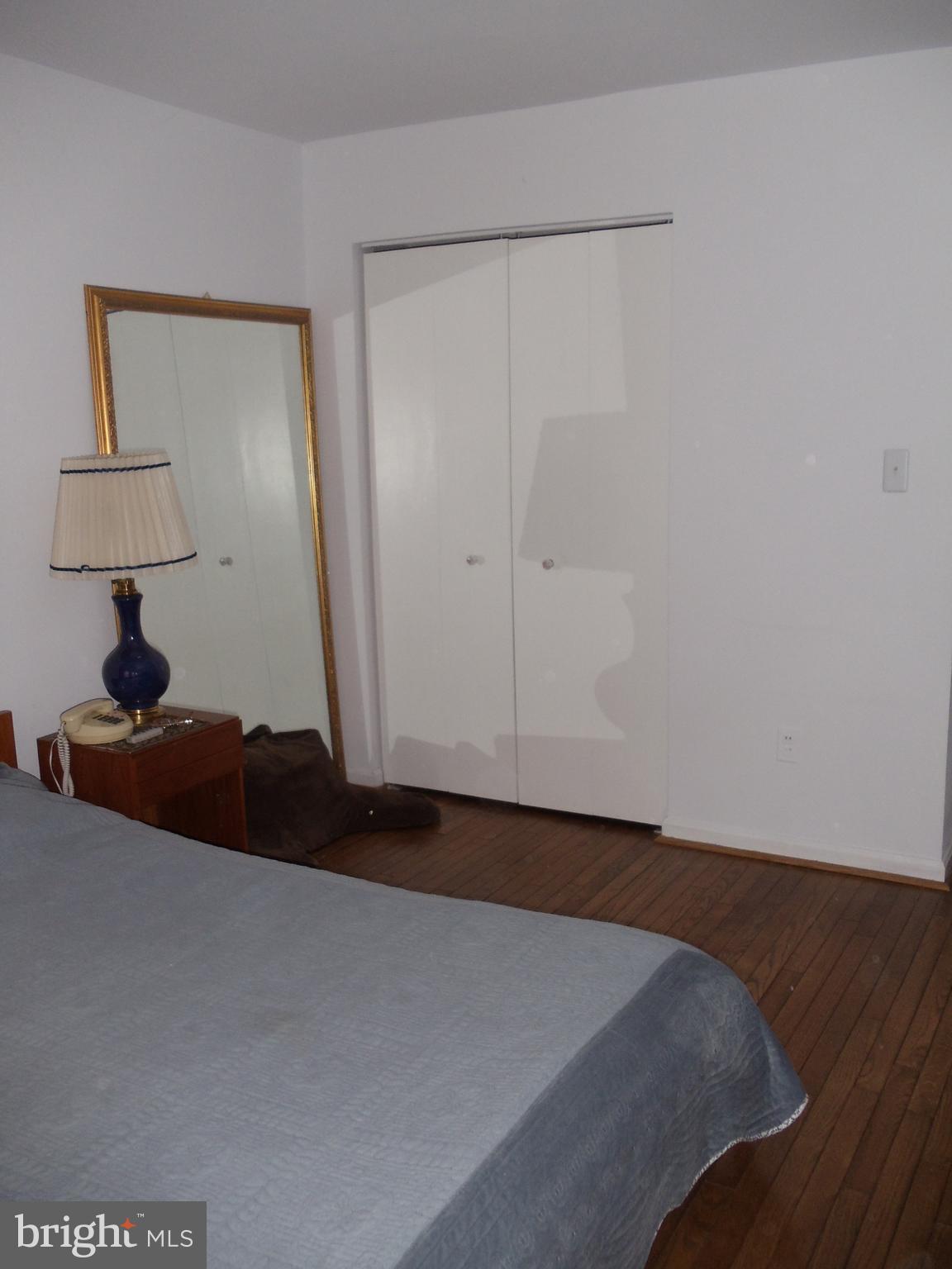 2186 Golf Course Drive Reston, VA 20191 - Photo 15 of 30 a lamp on a dresser in a room