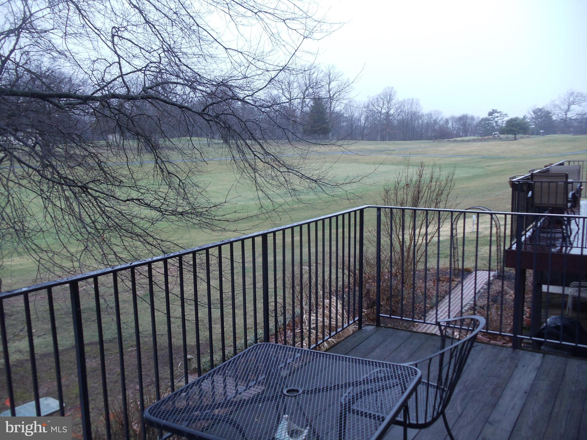 2186 Golf Course Drive Reston, VA 20191 - Photo 23 of 30 a balcony with wooden floor and lake view