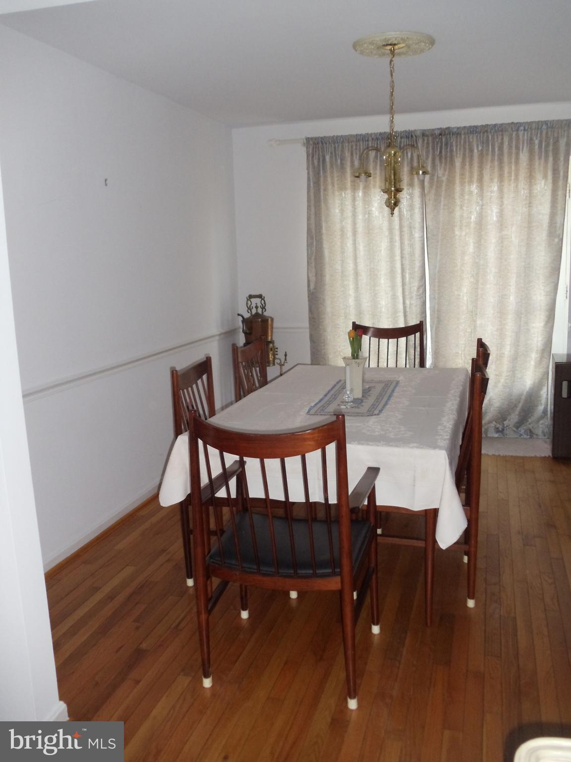 2186 Golf Course Drive Reston, VA 20191 - Photo 26 of 30 a view of a dining room with furniture window and wooden floor